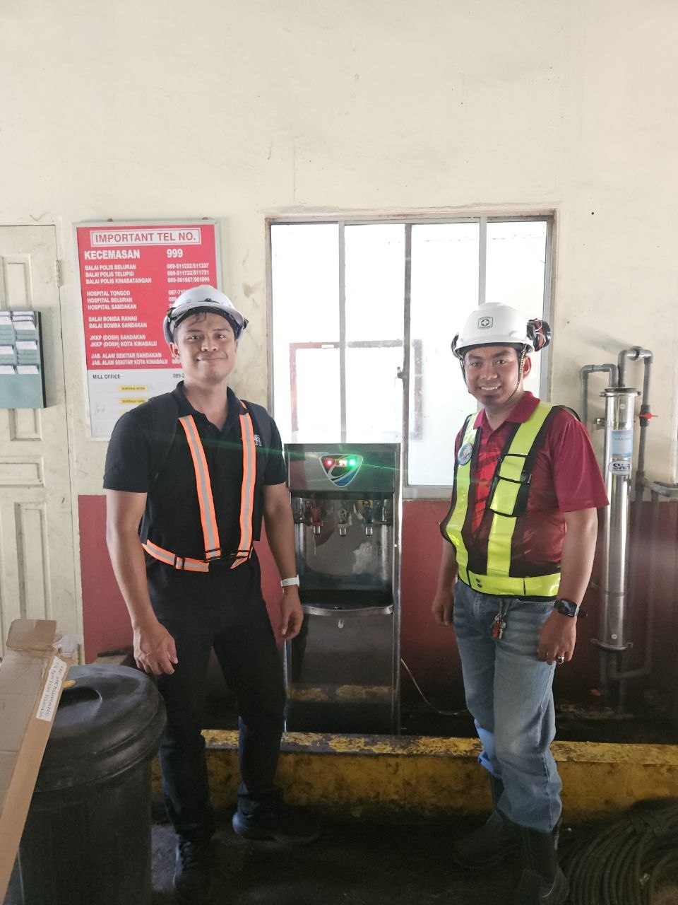SWFI team at the Genting Tanjung drinking-water dispenser