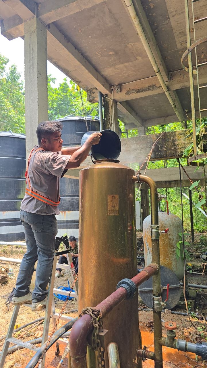 SWFI technician opening the filter vessel