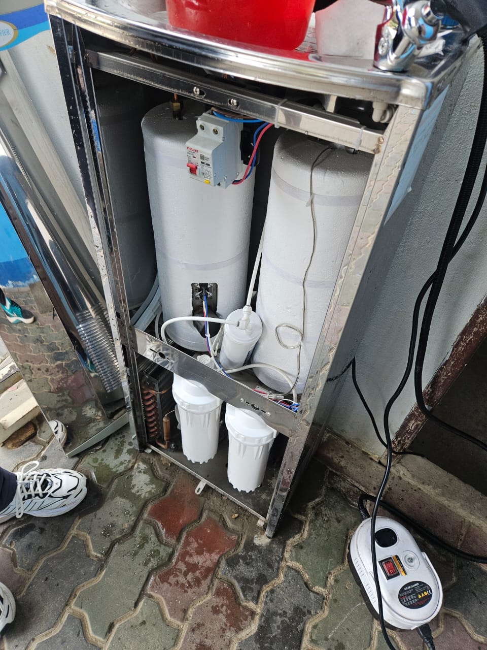 SWFI dispenser maintenance photo 1